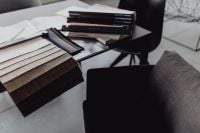 Kaboompics - Open Interior Material Sample Catalogs Beside a Black Office Chair