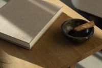 Kaboompics - Minimalist Home Decor with Book and Decorative Bowl on Wooden Table