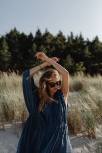 Kaboompics - Woman in Sunglasses Wearing Blue Kaftan in Dunes
