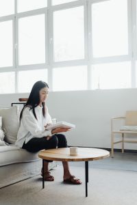 Kaboompics - Woman Reading in a Calm Living Room