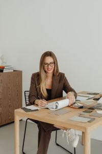Kaboompics - Interior Designer Planning Space Layout With Floor Plans