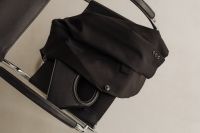 Kaboompics - Black Handbag and Black Blazer Button on Chrome Chair