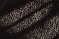 Kaboompics - Black Fuzzy Fabric Texture with Diagonal Fold