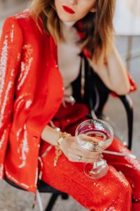 Kaboompics - Red Sequin Outfit Detail with Champagne and Silver Streamers