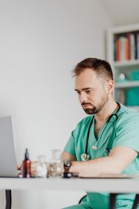 Kaboompics - Doctor Portrait Seated Behind Office Desk