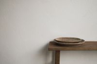 Kaboompics - Close-Up Wooden Bench with Stacked Ceramic Plates