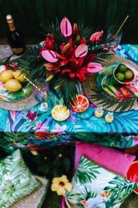 Tropical Garden Party Tablescape with Floral Textiles, Citrus Decor and Colorful Summer Drinks