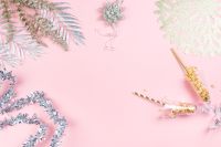Kaboompics - Pink New Year Background with Silver Tinsel and Champagne