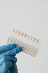 Kaboompics - Dental Shade Guide Held Against White Background
