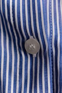 Kaboompics - Grey Button on Blue White Striped Shirt – Macro Detail