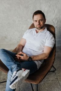 Kaboompics - The man is sitting in a chair and relaxing