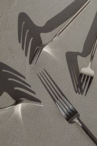 Kaboompics - Fork Shadows and Stainless Steel Cutlery on a Neutral Background