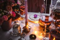 Kaboompics - Pink Floral Christmas Table Setting with Gift and Candlelight