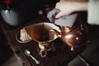 Kaboompics - Overhead Chemex Pour-Over Coffee Brewing with Copper Kettle and Red Roses on Dark Wood
