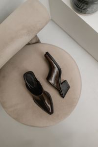 Kaboompics - Brown Leather Shoes on Round Beige Stool
