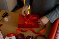 Kaboompics - Red Gift Box with Ribbon on Wrapping Table