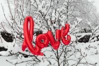 Kaboompics - Red LOVE Balloon Among Snowy Winter Branches