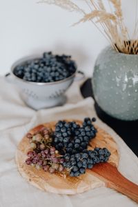 Kaboompics - Fresh Blueberries and Grapes in a Rustic Kitchen Scene