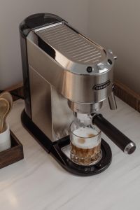 Kaboompics - Finished Layered Coffee Beside Espresso Machine