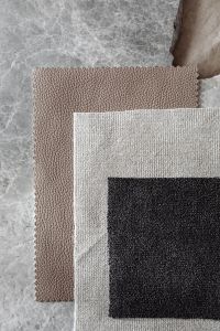 Kaboompics - Neutral Fabric Swatches with Black Center on Stone