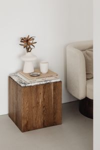 Kaboompics - Contemporary Interior Styling with Walnut Pedestal, Art Books and Upholstered Armchair