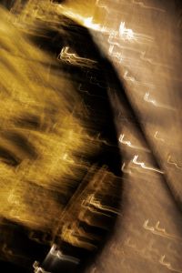 Kaboompics - Soft Gold Light Trails and Dark Diagonal Swirls, Vertical Motion Blur Texture