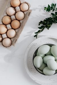 Kaboompics - Easter flat lay with green eggs on a white marble
