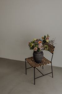 Kaboompics - Small Bouquet Against Textured Wall with Generous Copy Space