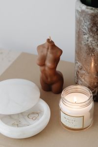 Kaboompics - Brown Sculptural Figurine and Candle Still Life