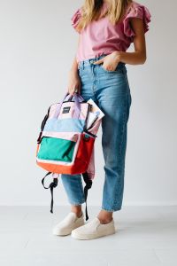 Kaboompics - Student Holding Colorful Backpack