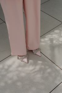 Kaboompics - Close-Up of Pale Pink Trousers and Embellished Bow Heels
