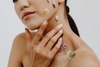Kaboompics - Hands on Neck and Shoulder with Tiny Floral Accents, Asian Beauty Portrait Crop