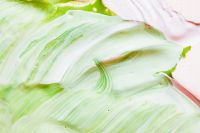 Kaboompics - Soft Green Marble-Like Paint with Blush Pink Accents for Pastel Branding Backgrounds