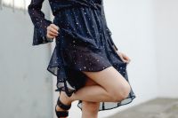 Kaboompics - Cropped Woman in Navy Polka Dot Dress with Bent Leg and Black Heeled Sandal