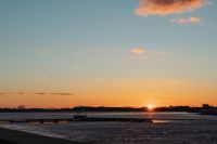 Kaboompics - Wide Winter Lake with a Long Dock at Sunset