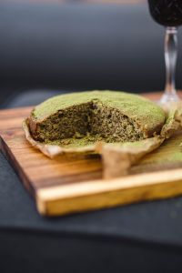 Delicious homemade matcha cake on a wooden board
