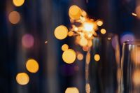 Kaboompics - New Year's Eve Champagne Flute Silhouette with Blue and Gold Bokeh Copy Space