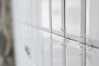 Kaboompics - Laying white ceramic tiles in the bathroom
