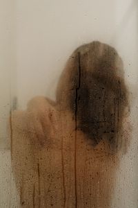 Kaboompics - Woman Showering Behind Fogged Glass