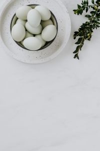 Kaboompics - Easter flat lay with green eggs on a white marble
