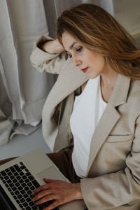 Kaboompics - Businesswoman Resting with Eyes Closed beside Her Laptop