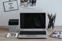 Kaboompics - Silver Laptop and Pencils beside Black-and-White Posters, Minimalist Home Office Still Life