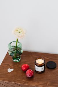 Kaboompics - Candle in a jar - plums - furniture