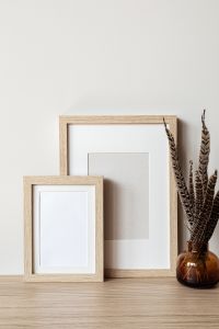 Kaboompics - Layered Picture Frame Mockup with Amber Vase and Dried Feathers
