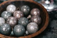 Kaboompics - Silver Christmas Balls Arranged in a Wooden Bowl