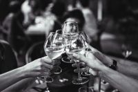 Kaboompics - People holding glasses of white wine making a toast