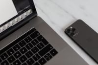 Kaboompics - MacBook Pro 15 laptop and iPhone 11 Pro on a marble table