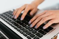 Kaboompics - Hands Typing on a Laptop Keyboard, Remote Work Productivity Background for Editorial Design