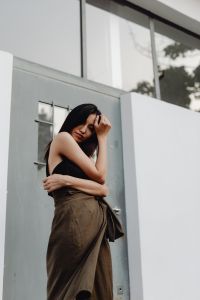 Asian Fashion Model in Minimalist Neutral Outfits and White Wall Backgrounds