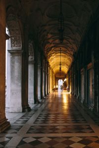 Kaboompics - Warmly Lit Venetian Arcade with Repeating Stone Columns